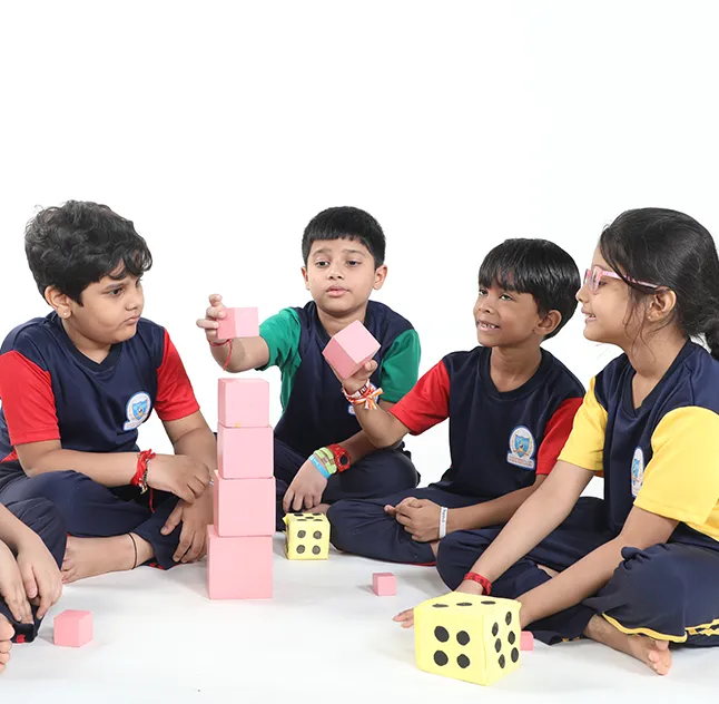 TSGE Primary School students playing with building blocks and dice